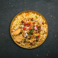 Beach Bhel Puri · Made of puffed rice, vegetables and a tangy tamarind sauce, and has a crunchy texture.