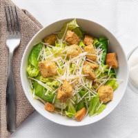 Caesar Salad · Chopped romaine lettuce tossed in caesar dressing with croutons and Parmesan cheese.