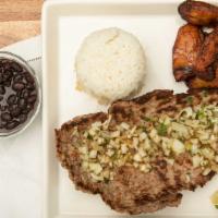 Baby Palomilla · A pounded baby tri-tip steak grilled and topped with chopped onions served with white rice, ...