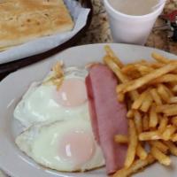 Huevos Fritos · 2 Huevos Frito, Café con Leche, Papitas Fritas o Hashbrown y Tostadas Cubana. Opciones adici...