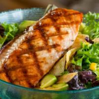 Grilled Salmon Salad · Crisp greens tossed with grilled chicken, avocado, roasted sweet corn, bleu cheese crumbles ...