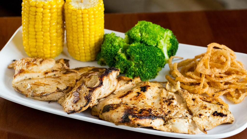Flat Grilled Chicken Breast · Two Flat Grilled Chicken Breasts (12 oz), rubbed with our secret recipe of herbs and spices. Served with two sides and garnished with Yuca Fries.