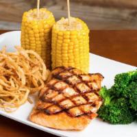 Grilled Salmon · Delicious Grilled Salmon fillet (8 oz). Served with two sides and garnished with Yuca Fries.