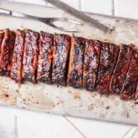 Louis Style Spareribs (A La Carte) · The Big Slab (40 oz). Hand-rubbed with Dave’s secret blend of special spices and pit-smoked ...