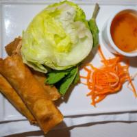 Fried Imperial Rolls · Served with Vietnamese dipping sauce, lettuce wrappers, pickled veggies, and herbs.