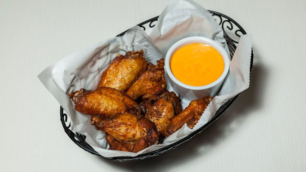 Chicken Wings · Marinated chicken wings that are deep-fried in unsalted butter.