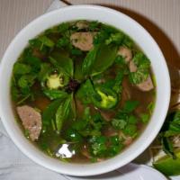 Combination Pho · Combination noodle soup with rice noodle, traditional beef broth, thinly sliced rare steak, ...