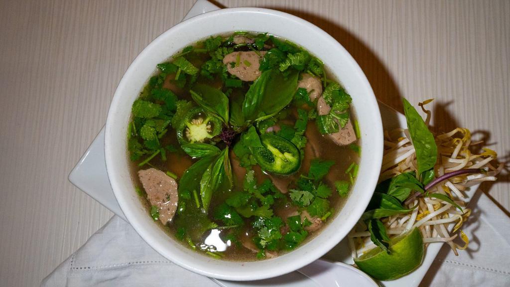 Combination Pho · Combination noodle soup with rice noodle, traditional beef broth, thinly sliced rare steak, brisket, and beef meatballs. Served with beansprouts, basil, jalapenos, and lime. Accompanied with hoisin and sriracha sauces.