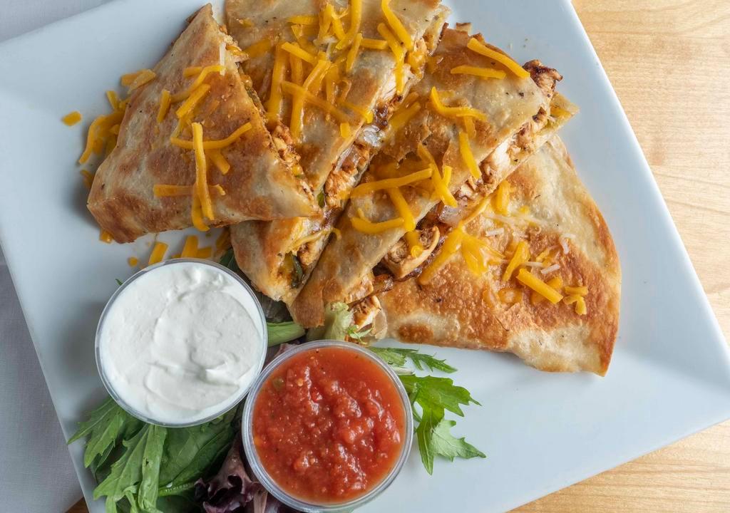 Grilled Chicken Fajita Quesadilla · Grilled white meat chicken folded into a flour tortilla with melted monterey jack and cheddar cheese, sauteed green bell pepper and sauteed onion, garnished with shredded monterey jack and cheddar cheese, served with sides of sour cream and our homemade salsa.