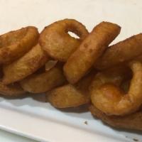 Beer Battered Onion Rings · Our famous beer battered, deep fried, thick cut onion rings.