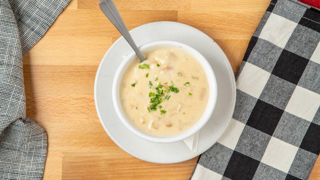 Clam Chowder · New england style clam chowder made from scratch with our own recipe, rich and creamy, loaded with clam, potato, celery and onion, served with oyster crackers.