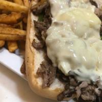 Philly Steak · Shaved steak with sauteed onion and green bell pepper, topped with melted american cheese, s...