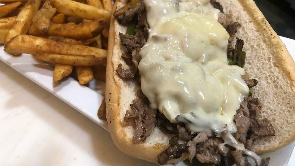 Philly Steak · Shaved steak with sauteed onion and green bell pepper, topped with melted american cheese, served on a toasted hoagie roll.