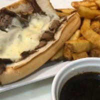 Prime Rib French Dip · Shaved steak with melted provolone served on a toasted hoagie roll with homemade au jus for ...