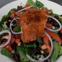 Salmon Salad · Fresh grilled Atlantic salmon atop. a bed of spinach with bacon, bleu. cheese crumbles, toma...