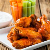 Buffalo Chicken Wings · Six baked satisfying Buffalo chicken wings served with celery, ranch and carrots.