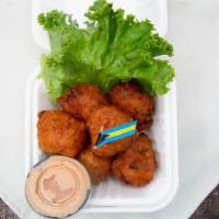 Conch Fritters (6) · 6 only Mouth Watering Fritters 
Includes  1 Conch Sauce