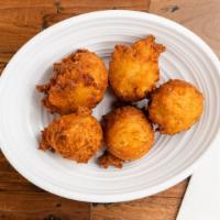 Hush Puppies (5) · House-made dough, fried golden, and served fresh with our house jam.