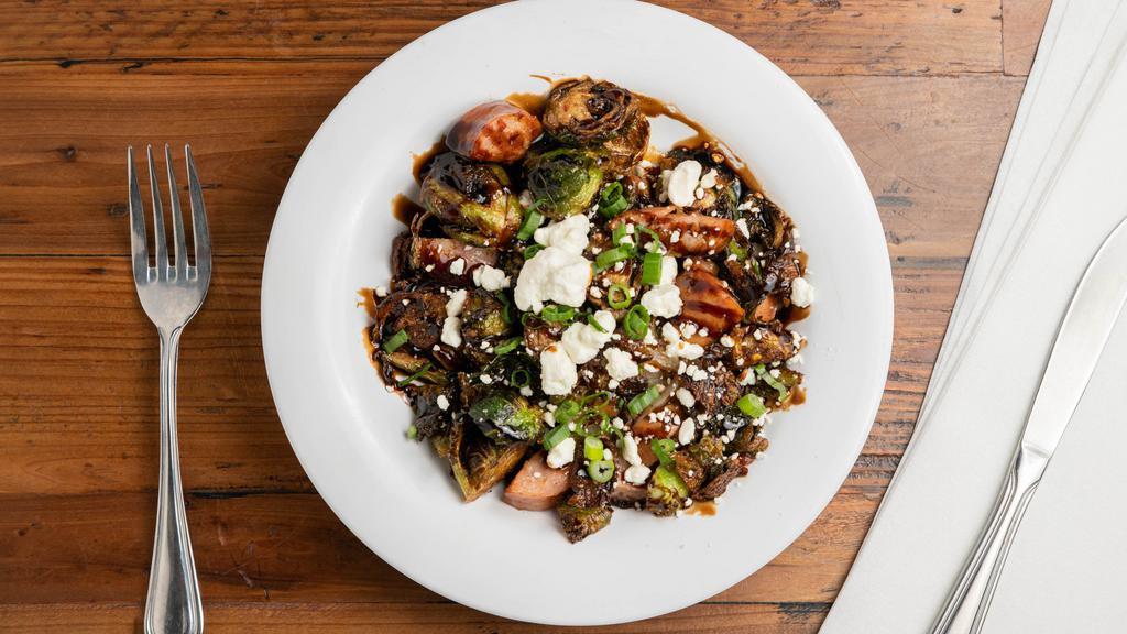 Chef Jason'S Brussels · Crispy Brussel sprouts, balsamic reduction, local azar sausage, bacon, caramelized onion, goat cheese crumbles.