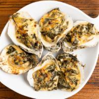 Oysters Rockerfeller (Southern Style) · Gulf Oysters topped with collards, bacon, parmesan
