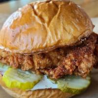 Cajun Chicken Sandwich · Crispy, double battered fried chicken breast, tossed with Cajun Dry Rub seasoning, with pick...