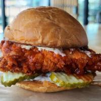 Buffalo Chicken Sandwich · Crispy, double battered fried chicken breast, tossed in buffalo sauce with pickles and jalap...