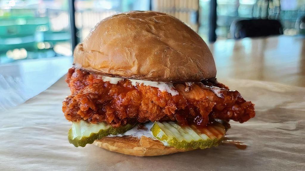 Buffalo Chicken Sandwich · Crispy, double battered fried chicken breast, tossed in buffalo sauce with pickles and jalapeno ranch.