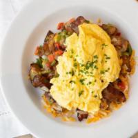 Westside Pileup · skillet potatoes topped with onions, peppers, cheddar cheese, bacon, two eggs scrambled.