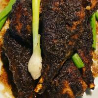 Jerk Chicken Large · Chicken wings made from soy, smothered with a spicy house jerk sauce - Jamaican style. Scrol...