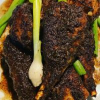 Jerk Chicken Small · Chicken wings made from soy, smothered with a spicy house jerk sauce - Jamaican style. Scrol...