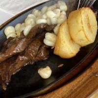 Anticuchos De Corazón · Grilled beef hearls in Peruvian panca sauce.

Consuming raw or under cooked meats, poultry, ...