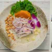 Ceviche Mixto · Mixed ceviche fish and seafood.