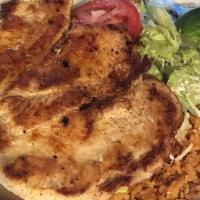Pollo Loco · Chicken breast marinated in our special recipe, then grilled. Served with Mexican rice, lett...