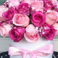 Shady Pinks  · Different tone Roses Arrangement in box with pink satin bow.