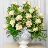 White Dreams · Fresh white roses arranged in white vase.
The perfect white blooms.