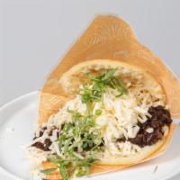 Arepa De Pabellón Criollo · Shredded beef, sweet plantain, black beans and shredded white cheese.