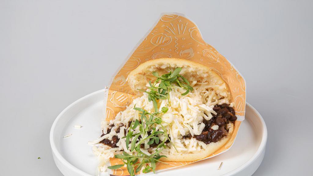 Simon Bolivar Arepa · Beef, with pico de gallo (tomatoes, red onions and cilantro) and shredded white cheese.