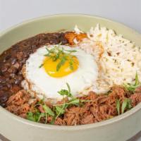 Pabellón Criollo Venezolano · Shredded beef, black beans, ripe plantains and white rice. Includes two sides.
