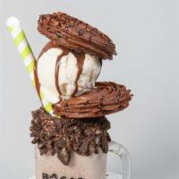 Oreo Churro Milkshake · Oreo milkshake topped with a chocolate churro ice cream sandwich.