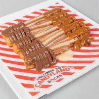 Churros · Pop churros with the toppings of your choice (nutella, condensed milk, dulce de leche).