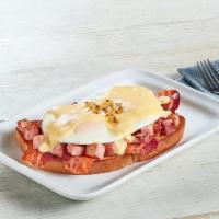 Southern Style Benedict · Two eggs over easy, 3 strips of bacon, and diced ham smothered with hollandaise sauce and a ...