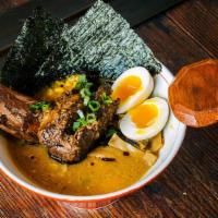 Shoyu Ramen · Chicken broth
hanjuku egg, scallions, bamboo shoot, nori, corn, kikurage mushrooms
choice of...