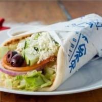 Veggie Pita  · Hummus, lettuce, tomatoes, onions, cucumbers, kalamata olives, and feta cheese on a pita. Se...