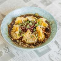 Sichuan Wontons · Six per order, steamed chicken, shrimp, and mushroom wontons with bean sprouts served in a p...