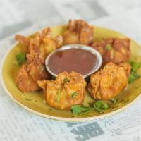 Golden Wontons · Six per order, deep-fried chicken, shrimp, and mushroom wontons, with a sweet chili sauce on...