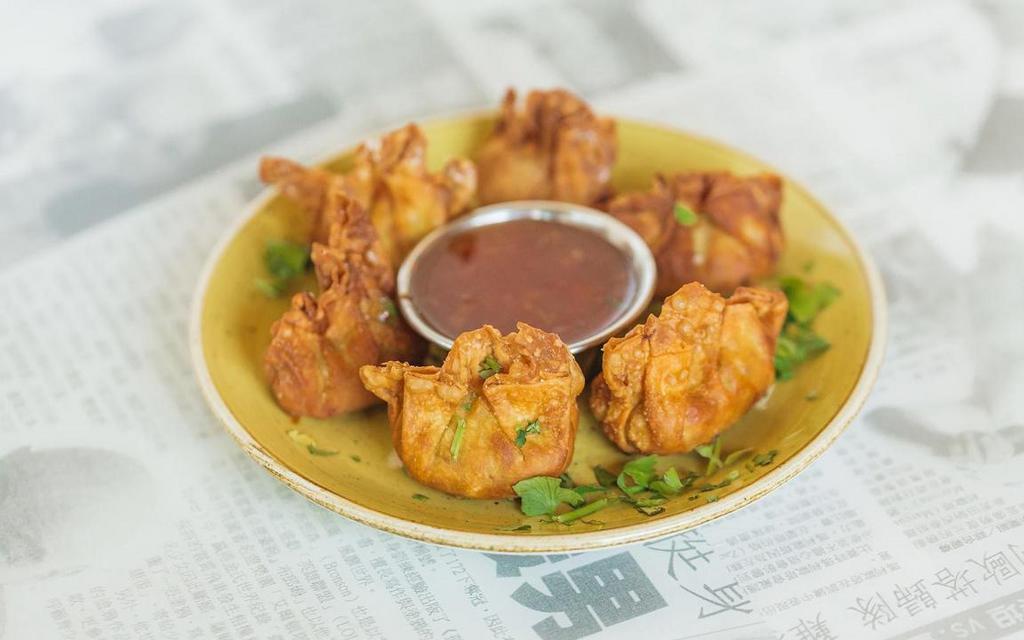 Golden Wontons · Six per order, deep-fried chicken, shrimp, and mushroom wontons, with a sweet chili sauce on the side