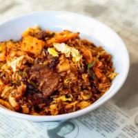 Kimchi Fried Rice · Spicy housemade kimchi, steak, egg,. onions, soy and gochujang sauce.