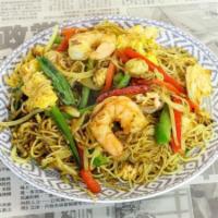 Singapore Mei Fun · Thin rice noodles dusted with yellow. curry and wok-fired with chicken,. shrimp, eggs, and v...