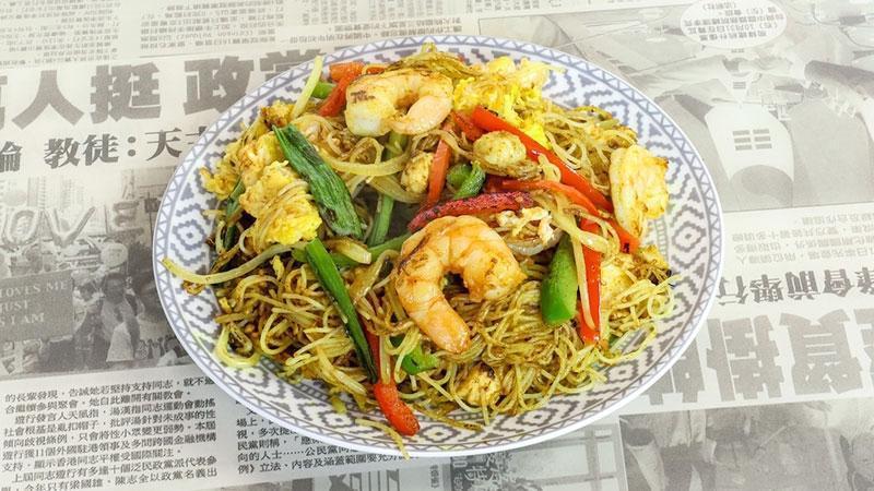Singapore Mei Fun · Thin rice noodles dusted with yellow. curry and wok-fired with chicken,. shrimp, eggs, and veggies.