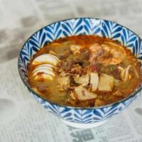 Curry Laksa · Spicy coconut curry stew brimming with shrimp, chicken, fried tofu, wheat noodles, bean spro...